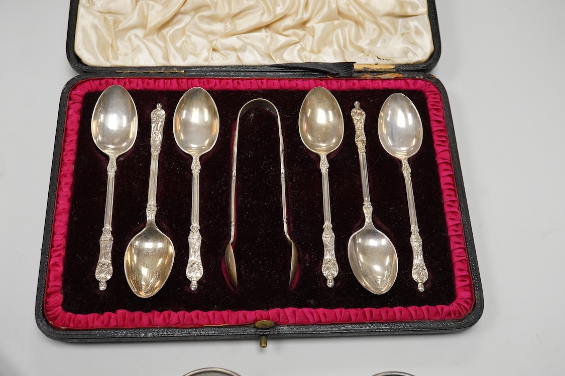 A cased set of six George V silver pastry forks, by Atkin Brothers, Sheffield, 1931, together with a cased set of six Edwardian silver apostle teaspoons and pair of sugar tongs, by Charles Stuart Harris & Sons, London, 1
